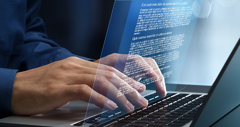 Man typing on laptop